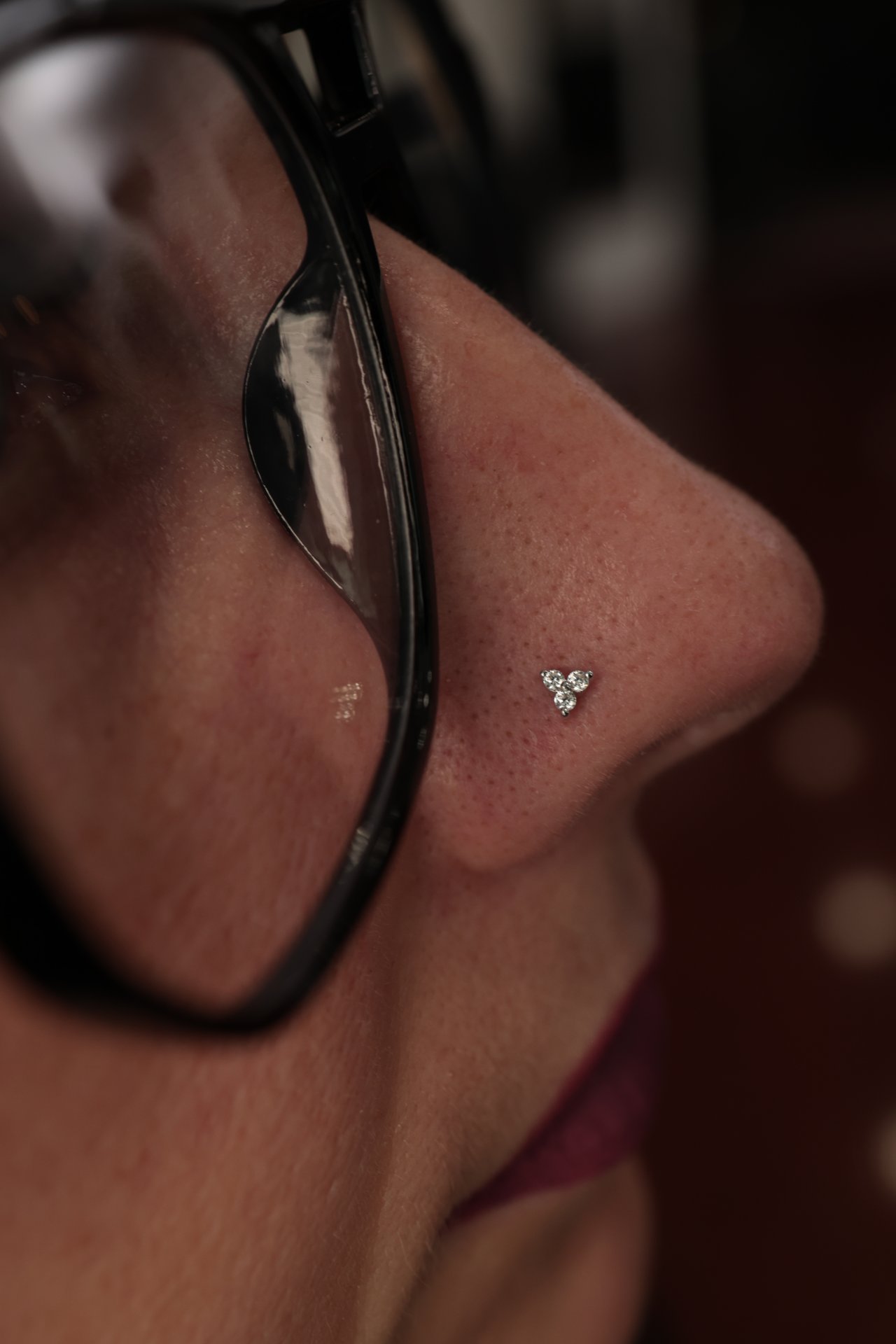 Diamond nostril stud catching light